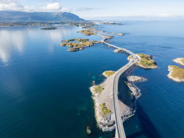 istock A long tiny road winding through rocky islands 2122703766