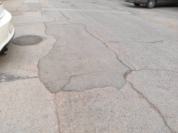 istock highways, damaged and patched asphalt roads. 2122725712