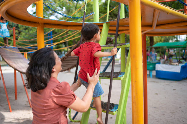 istock Mother and child in public park 2122739197