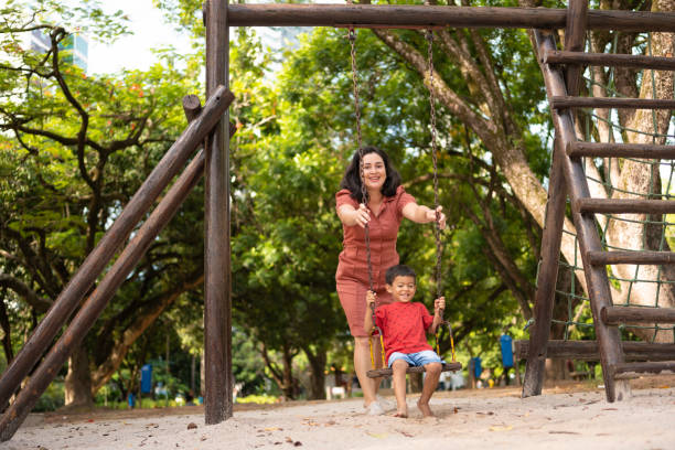 istock Mother and child in public park 2122739729