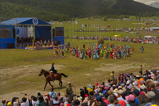 Ust-Kan. Russia. July 09, 2022. Young Altai girls and boys participate in the historical costumed performance of the main national holiday of the Altai Republic El-Oyin (national games).
