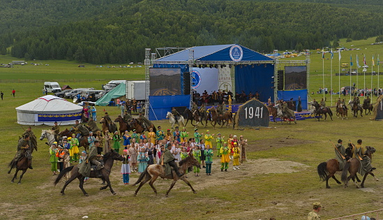 Ust-Kan. Russia. July 09, 2022. Young Altai girls and boys participate in the historical costumed performance of the main national holiday of the Altai Republic El-Oyin (national games).