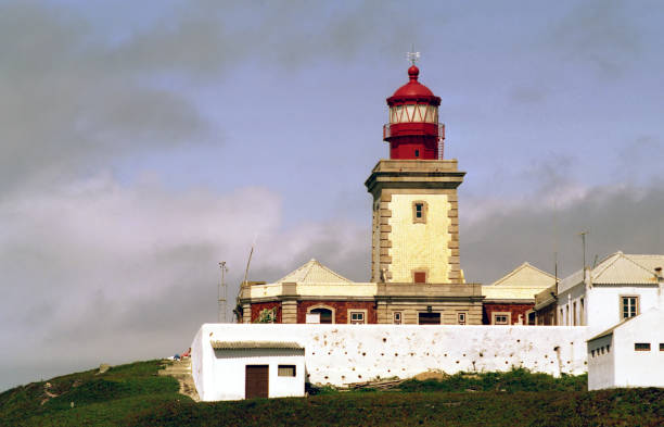 istock view of the lighthouse against the cloudy sky 2122806780
