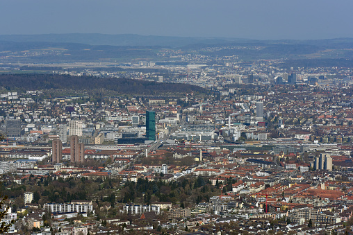 Zurich wide angle panoramic view. The image shows Zurich partially seen from the Uetliberg. Captured during spring season on a sunny day.