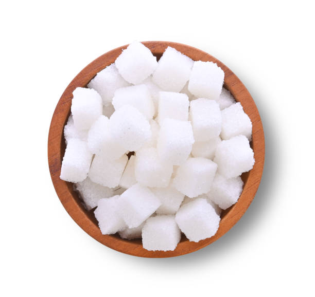 istock White sugar cubes in wooden bowl isolated on white background 2122857088