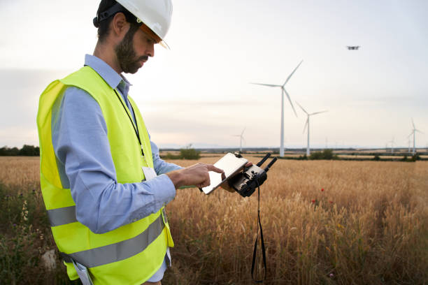 istock European engineer focused on using drone to inspect wind farm. People and technology in workplace. 2122877562