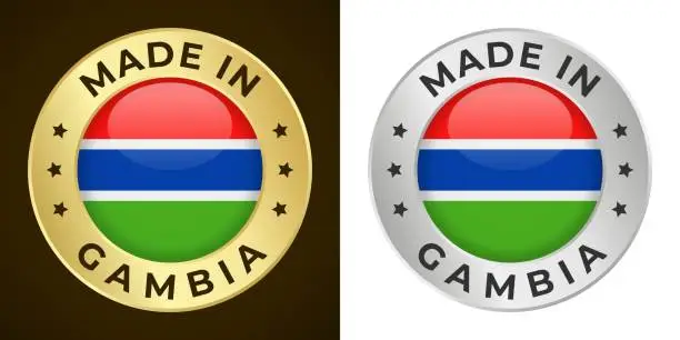 Vector illustration of Made in Gambia - Vector Graphics. Round Golden and Silver Label Badge Emblem Set with Flag of Gambia and Text Made in Gambia. Isolated on White and Dark Backgrounds