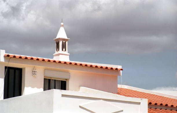 detail of a chimney stack against the sky