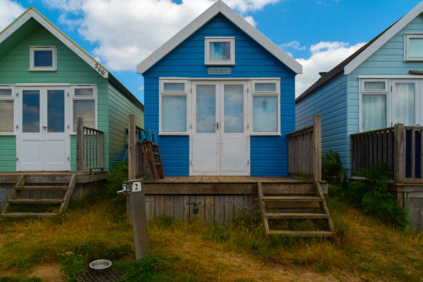 Hengistbury Head, UK - July 1st 2023: Beach huts on Mudeford Sandbank.