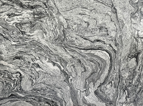 Granite has denser pores compared to marble. Grey granite is more found commonly. Granite is a common natural slab stone used in many countertop finishes and flooring. Seamless texture