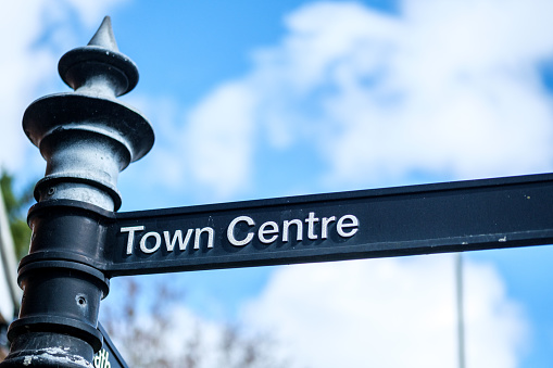 Leatherhead Surrey, UK, March 29 2024, Traditional Town Centre Dircection Sign Post With No People Against A Blue Sky