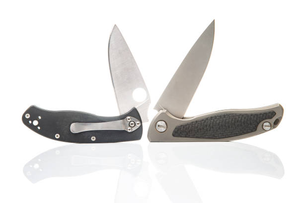 two folding knives on a white background. item for tourism and survival.