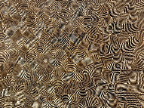 Texturized washed paint in brown and gold color. Fingerprint pattern, seamless, no people.