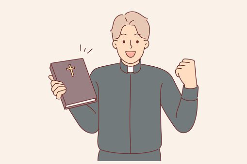 Guy in clothes of catholic priest rejoices at completing studies of bible, allowing to become rector of church. Happy man working in christian church showing book with crucifix on cover