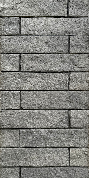 Grey brickwall andesite stone seamless texture for outdoor wall panel finishing.