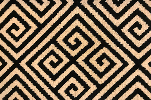 Greek Key or Meander Geometric Pattern rug carpet in creamy yellow black colors.
