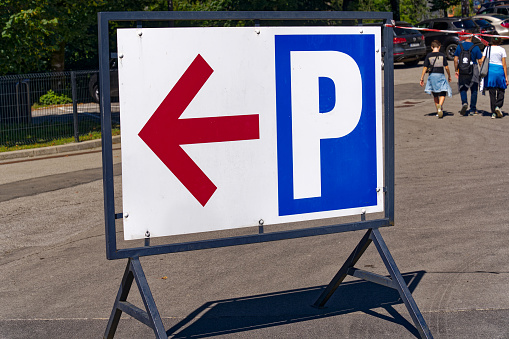 Close-up of a free parking sign in an English town.