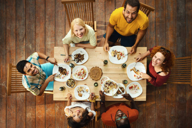 istock Friends and family having a dinner party. 2123043244