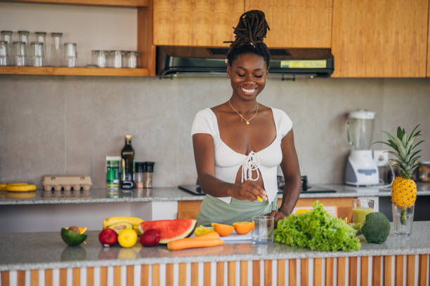 istock Woman Preparing Fresh Produce in a Modern Kitchen 2123043285