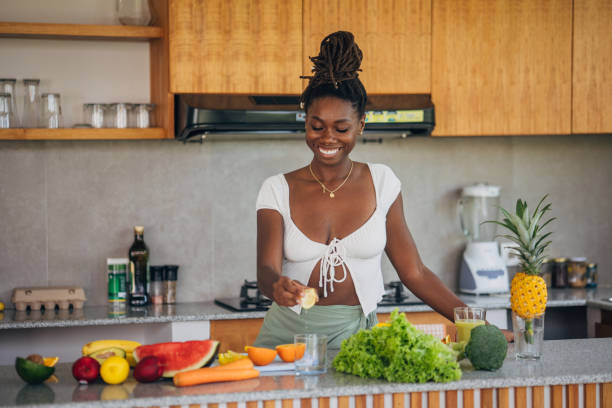 istock Woman Preparing Fresh Produce in a Modern Kitchen 2123043298