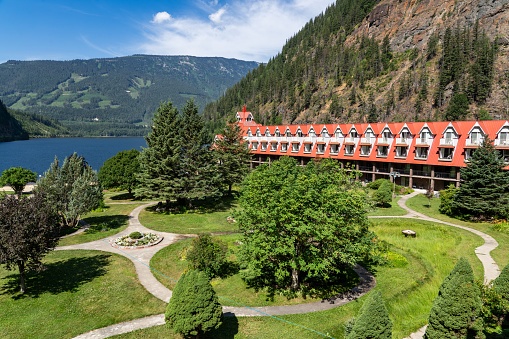 Three Valley Lake British Columbia Canada, July 10 2023: 3 Valley Gap lakefront Chateau overlooking green gardens and mountains along the Trans Canada Highway.