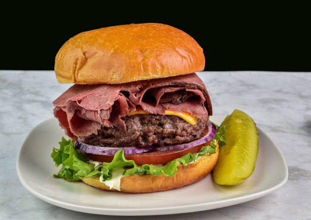 istock roast beef burger with tomato and onions served  with pickle 2123055903