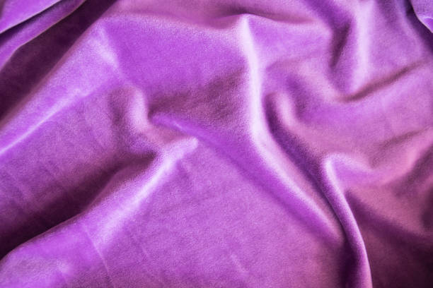 Lilac knitted texture fabric. Purple textile cloth background. Soft material for fashion clothes.