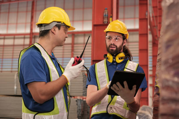 istock Team of engineers working at the factory 2123123921