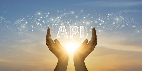 API. Man Holding Global Network and Connecting Data of Application Programming Interface with Business on the Internet, Streamlining Communication, Enhancing Integration.