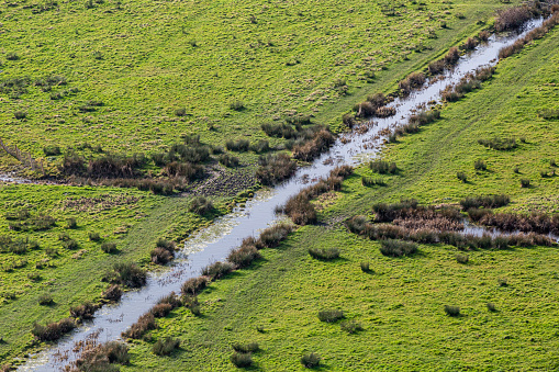 Looking down at a stream in rural Sussex, on a sunny winter's day