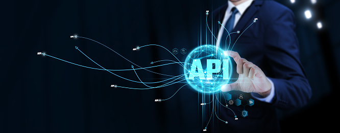 API: Businessman Touching Digital Global Network of API Data Exchange. Seamless Integration on Social Network Connection with Hologram Modern Interface, Advanced Functionality