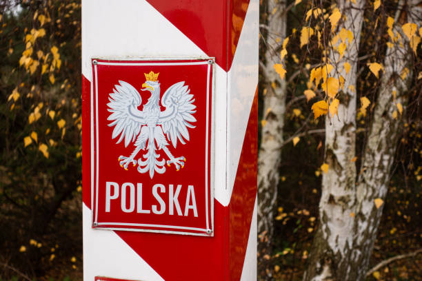 istock Polish border stone on the open border between Germany and Poland. Hiking trail between the seaside resort of Ahlbeck and Swinoujscie. Symbol in the landscape. dunes on the Baltic Sea coast. 2123189916