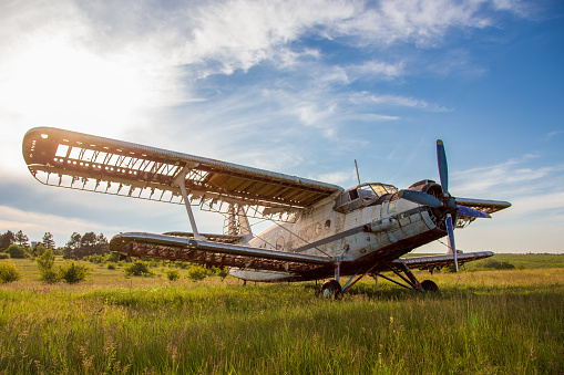 Abandoned old airplane on the field