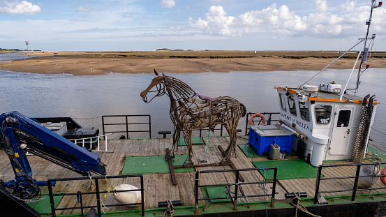Wells, Norfolk, UK  March 25 2024. Horse statue on the Port of Wells boat, North Norfolk coast