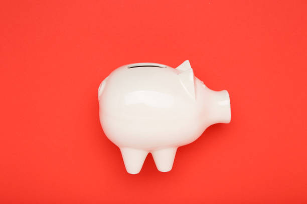 Piggybank on red background