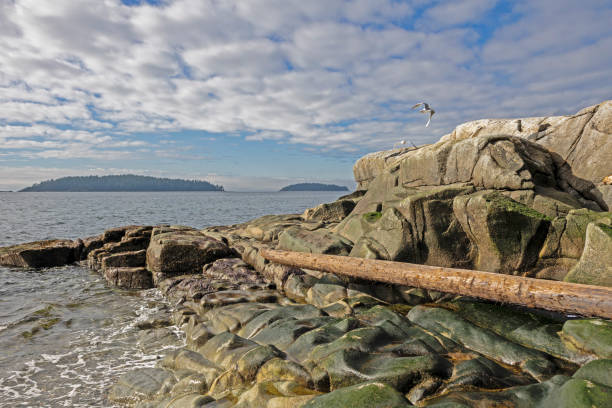 Rock outcrop above the ocean and islands in distance