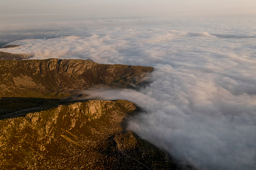 Aerial view of rugged coastal mountains and clouds