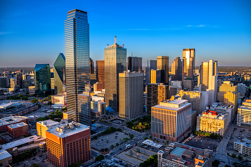 The buildings of downtown Dallas, Texas shot via helicopter from an altitude of about 400 feet at dusk on an early spring evening.