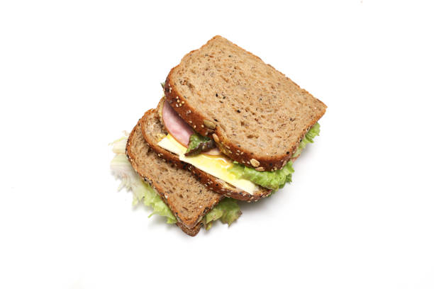 Giant sandwich with turkey meat, salad leaves, vegetables and cheese