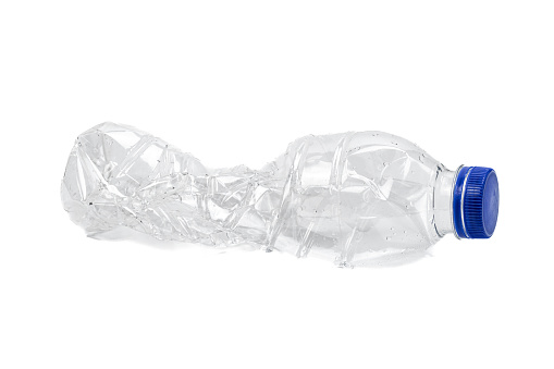 Crushed used plastic bottles isolated on white background.
