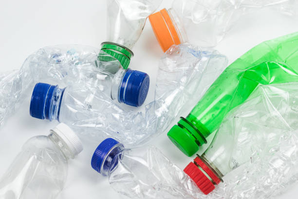 istock Pile of crushed used plastic bottles on white background. 2123365445