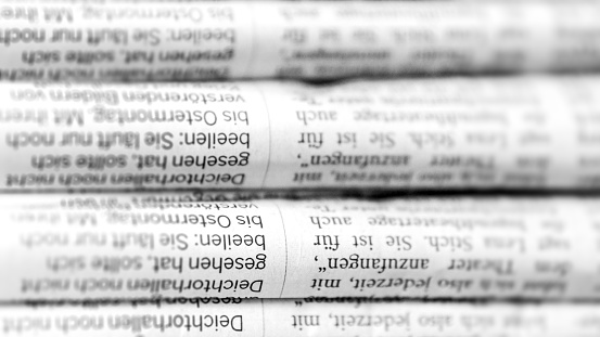 Stacks of identical German newspapers - 16:9 format