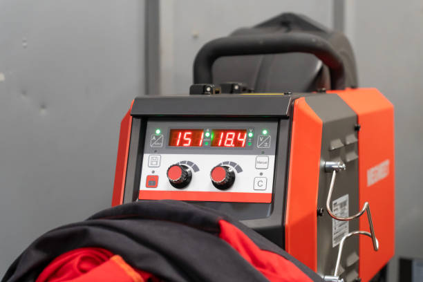 istock Red welding machine with digital displays and buttons in a welding workshop 2123418936