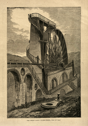 Vintage illustration, The Great Laxey Wheel, Isle of Man, 1872, 19th Century. The wheel was built in 1854 to pump water from the Glen Mooar part of the Great Laxey Mines industrial complex.