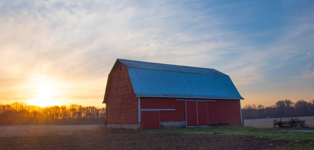 istock Red Barn at sunrise- Cass County, Indiana 2123460057