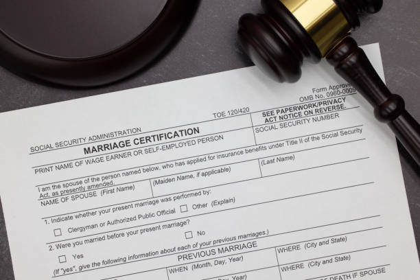 istock Marriage Certification request legal form with gavel and block on slate desktop 2123497896