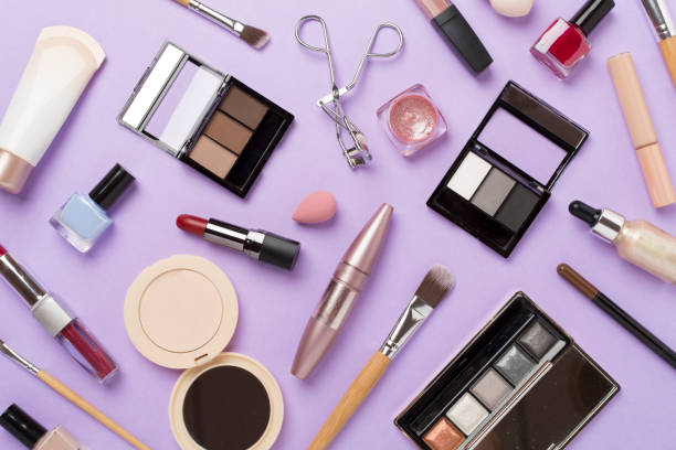 istock Flat lay with makeup products and tools on color background 2123588596