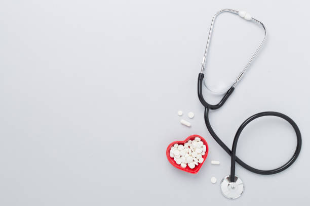 istock Stethoscope with heart medicines on color background, top view 2123588607