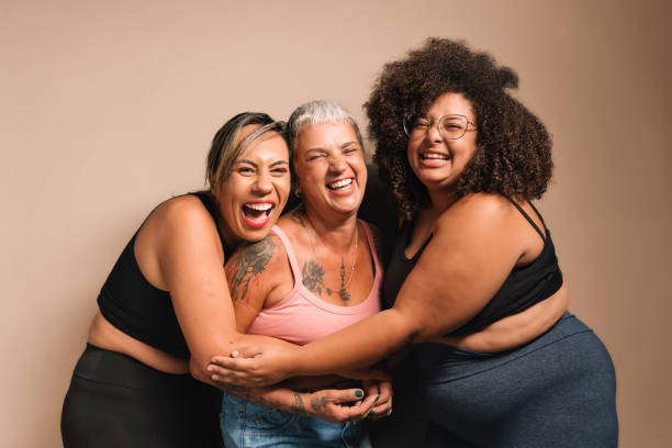 Women hugging each other laughing