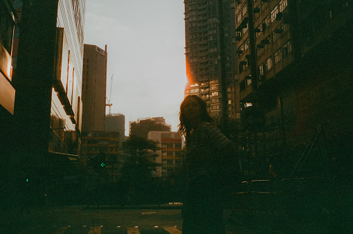 Woman exploring Hong Kong. Shot on camera film